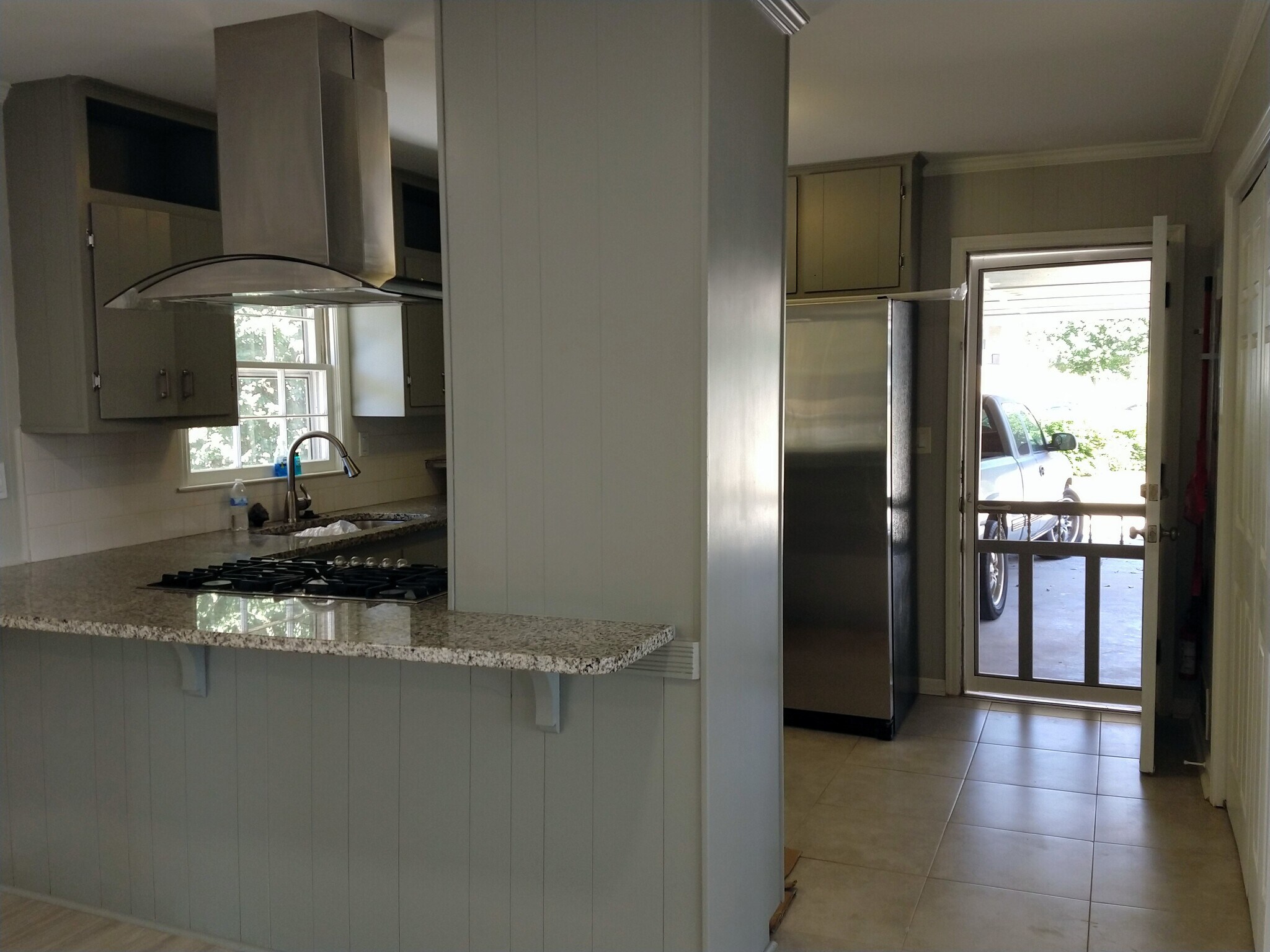 Kitchen off carport, stainless appliances - 6457 Peacock Blvd