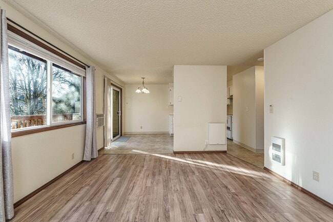 Building Photo - Updated 1 Bed / 1 Bath Upper-Level Condo with Balcony, Garage & A/C — Gated Community!