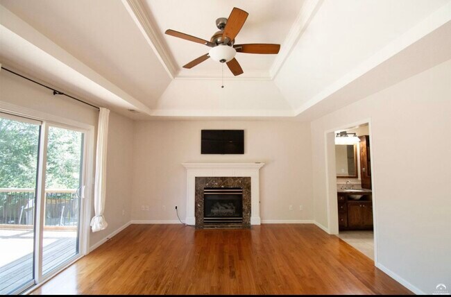 Primary bedroom with fireplace upstairs - 1524 Foxfire Dr