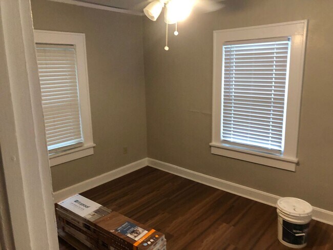 Building Photo - Freshly Painted 2x1 with Brand-New Plank F...