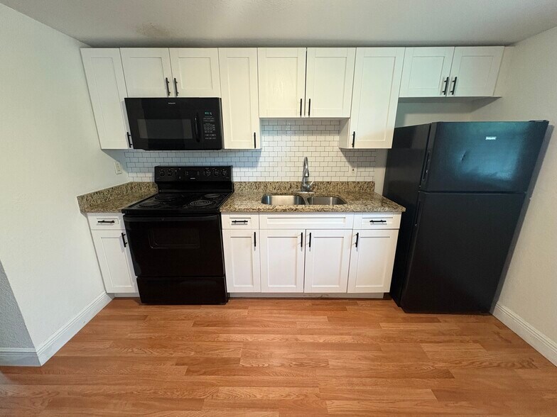 When you first walk in your front door you are greeted by a full kitchen - 10918 N Hyacinth Ave