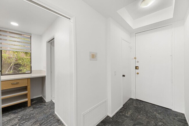 Entry way - interior view, view of powder room, kitchen, & entry to laundry room - 1745 S Bentley Ave