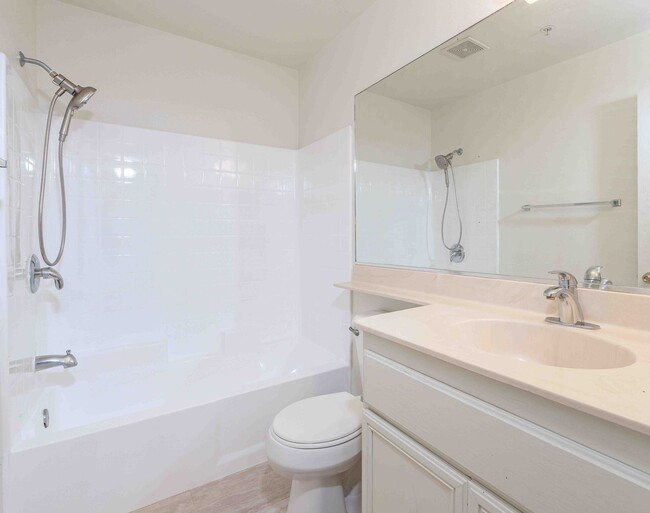 Building Photo - Gated Townhome with Updated Kitchen and Private Backyard