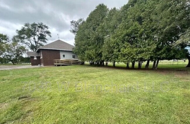 Building Photo - 7038 W Blanchard Rd