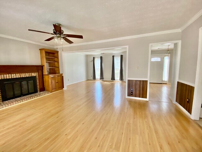 View of living room and family room with gas fireplace. - 2160 Heritage Trace Ln