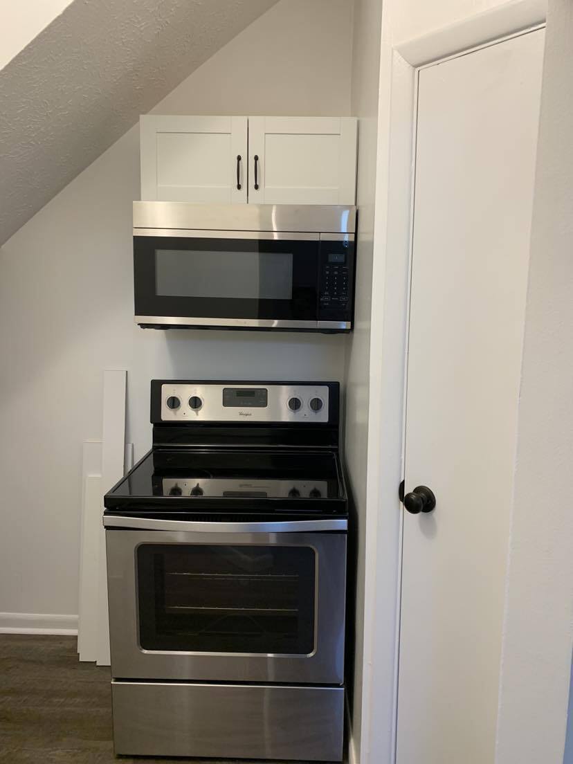 Newly installed above range SS microwave Pantry w/ new shelving - 1619 Mansfield St