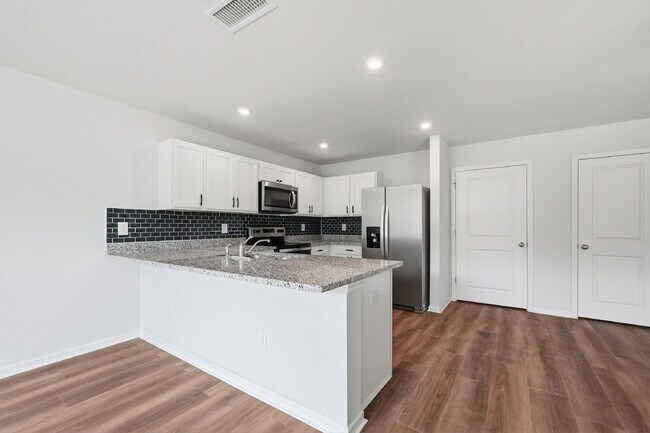 Building Photo - New community! Three bedrooms, two bathrooms and ready for you to move into!