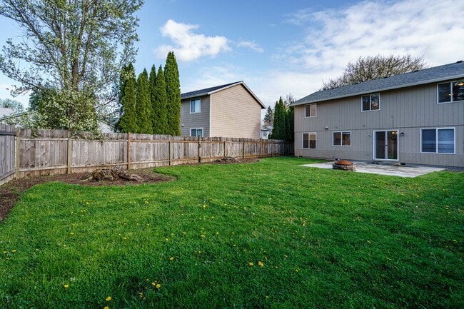 Building Photo - Recently Updated with Wood Laminate Flooring and Fresh Paint