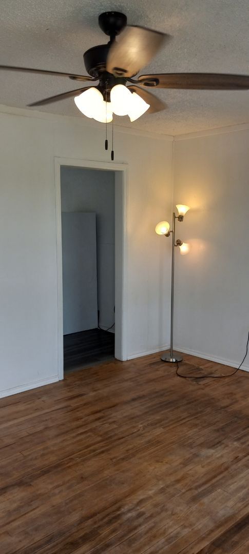Building Photo - NEW listing-refinished hardwood floors, new laminate and paint throughout