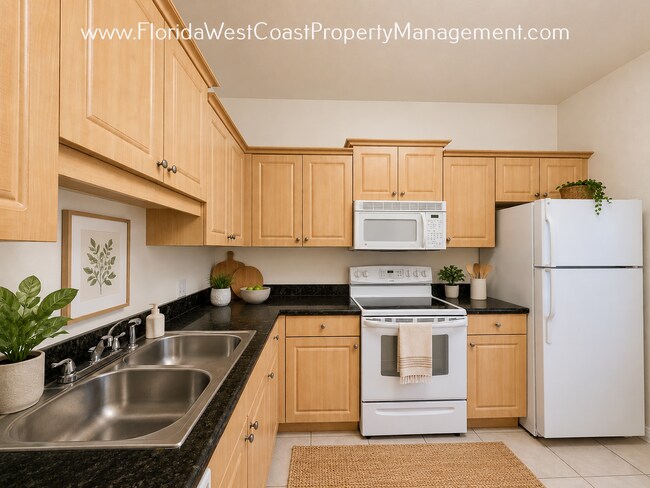 Building Photo - MOVE IN READY! 2 BEDROOM/2 .5 BATH - 1 CAR GARAGE! NEW LVP FLOORING IN LIVING! SUPER LOCATION!