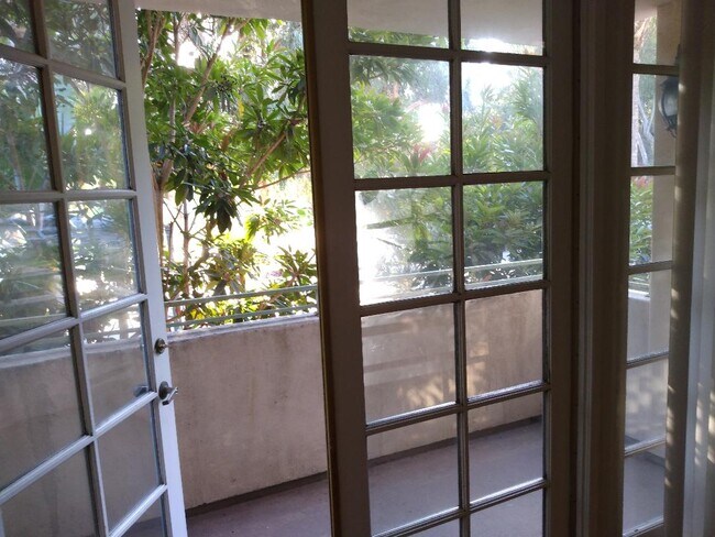 french doors opening up ont balcomy facing west - 640 Veteran Ave