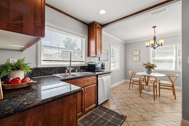 Building Photo - Welcome to this stunning 4-bedroom, 2-bath...