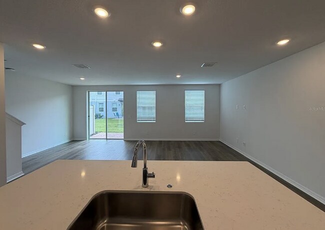 Building Photo - "Spacious 3-Bedroom Townhouse with Granite Elegance in St. Cloud – 4543 Rangeland Way"