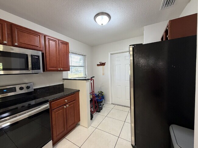 Building Photo - "Charming 3-Bedroom Home with Gleaming Hardwood Floors!"