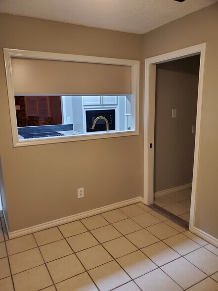 Kitchen open to dining area - 106 N Troy Ave