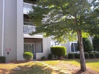 Building Photo - 4 bedroom Condo within Walking Distance to Lake Johnson and 5 mins to NC State
