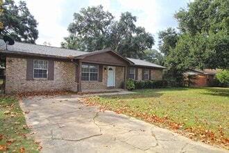 Building Photo - Spacious 3BR/1.5BA Home in Pace with Open Living Area, Tiled Family Room, and Fenced Backyard – M...