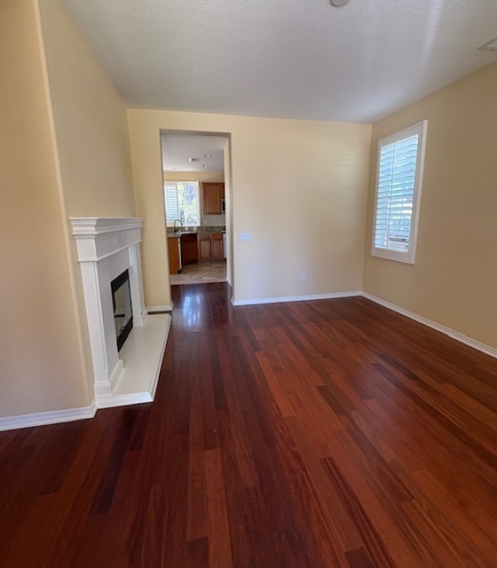 Enter the living room with abundance of natural light and hardwood floor - 26019 Brinton Plz