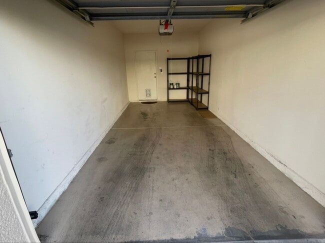 Building Photo - Modern Ground-Level Condo With A One Car Garage in Prime Southwest Location with Resort-Style Ame...