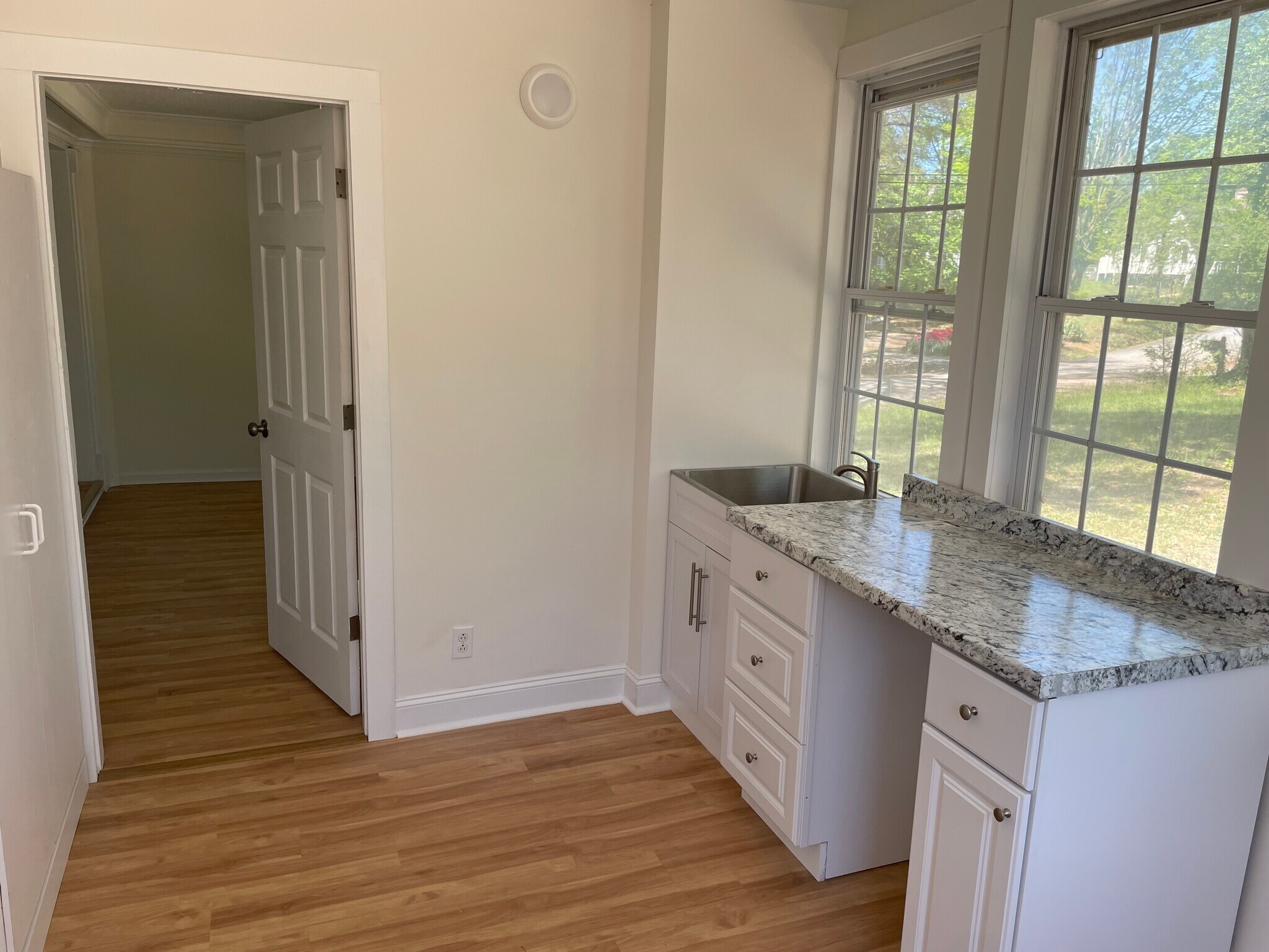 Mudroom with washer, dryer, and sink - 205 N Beacon St
