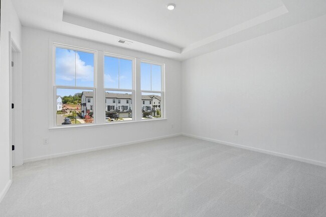 Building Photo - Brand-new three-story townhome in the Univ...