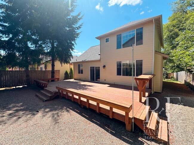 Building Photo - Dual Primary Suites, Huge Backyard Deck & Sun-Filled Living Spaces Near Everyday Conveniences