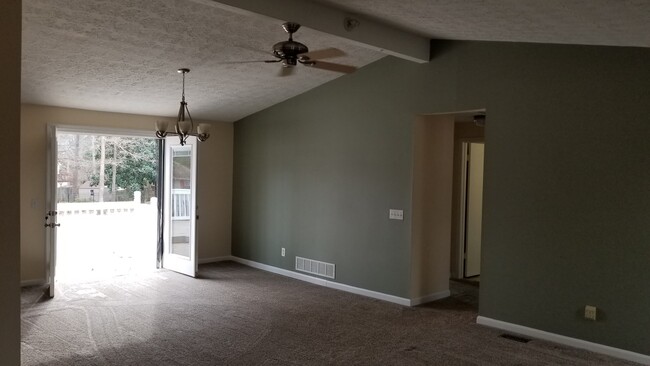 Living Room open to Dining Room with French doors leading to back porch - 850 Winfield Ct