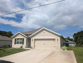 Building Photo - Modern 4-Bedroom Home with Large Backyard in Quiet SW Palm Bay – Available Mid-June