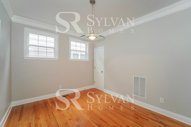 Building Photo - Welcome to this charming abode.