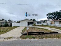 Building Photo - NEW FLOORS, NEW PAINT INSIDE & OUT.. 2/1/1...