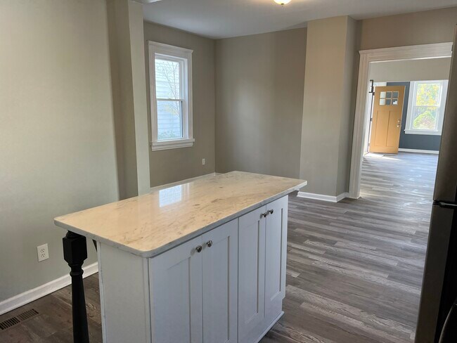 Open floor plan from kitchen into dining room - 1483 E 112th St