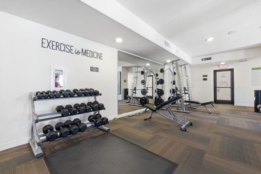 Modern fitness center featuring cardio, free weights, and strength equipment. - 2511 W Queen Creek Rd