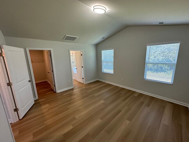 Master bedroom with walk in closet and bathroom - 7262 Heirloom Ln