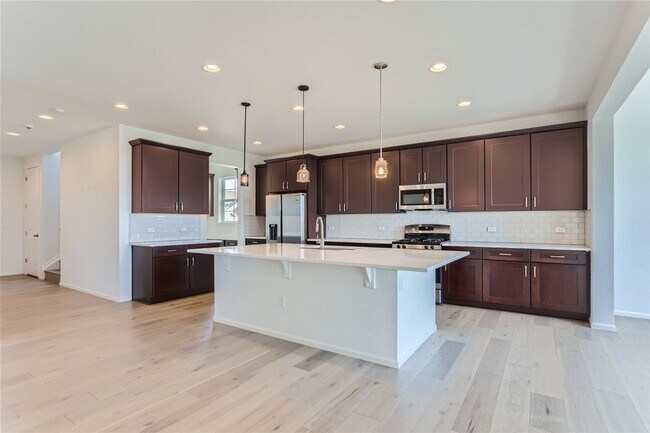 Building Photo - 3-Bedroom Home with Open Floor Plan, Private Balcony & Attached Garage