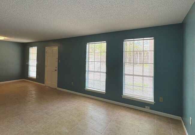 Building Photo - Centrally located freshly painted condo is...