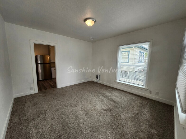 Unit 3 Living Room - The Highland at 936