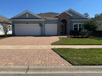 Building Photo - COMING SOON! Beautiful 4BR 3BA Home w/ Screened Lanai & Pond View • Garage Parking • Fenced Yard ...