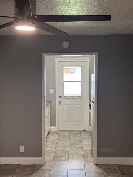 Front room access to galley kitchen - 128 NW 13th Avenue