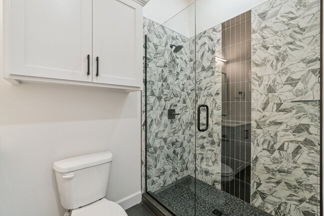 Building Photo - Bright. Clean. Calm. Your Elevated One-Bed...