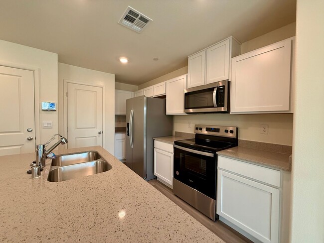 Building Photo - Brand-New Townhome for Rent in the Highly ...