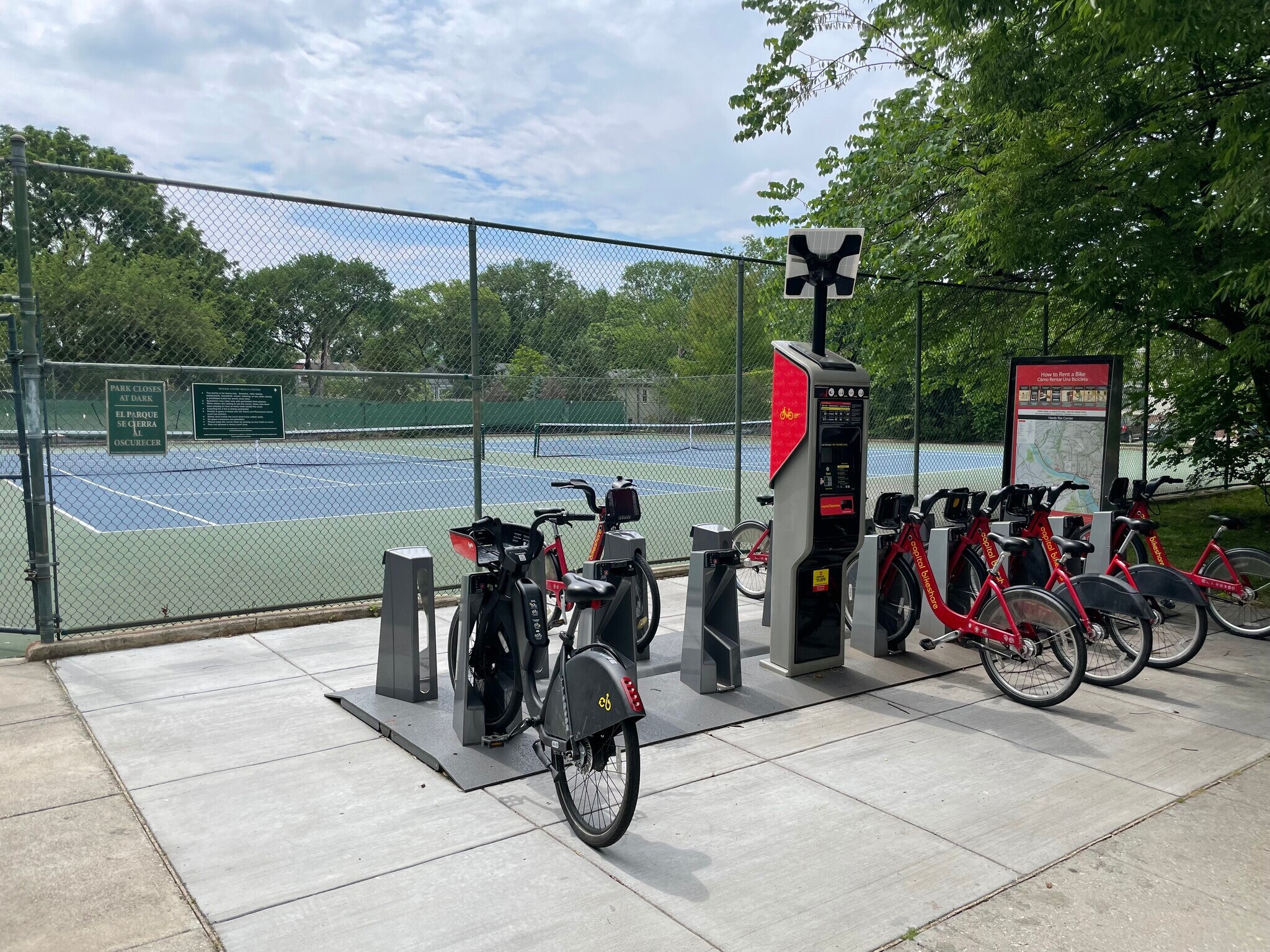 Looking east @ Hardy Park's tennis courts and bike rental station (from our condo's parking lot) - 4555 MacArthur Blvd NW