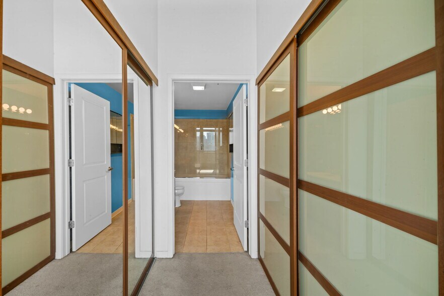 Walk-through closet from main bedroom into bathroom - 511 W Division St