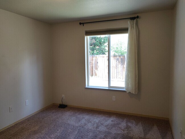 Building Photo - Charming 4-Bedroom Home on 1/2 Acre with a Fenced Backyard, Fully Insulated Double-Car Garage, in...