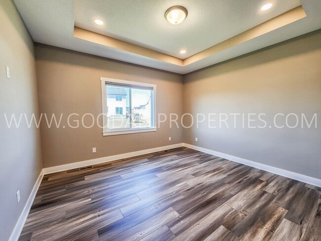 Building Photo - Spacious Waukee Ranch | 4 Bedrooms | 3-Car Garage | Finished Basement