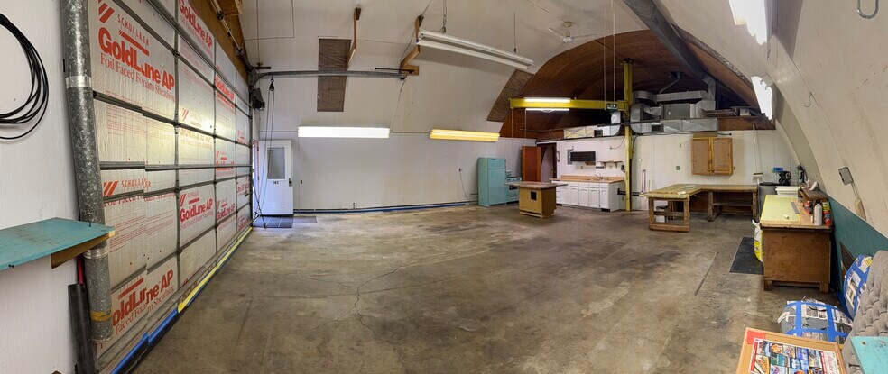 Main shop area, cooking area, and door to the bedroom/bathroom. - 145 N Hilltop Rd