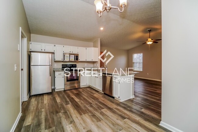 Building Photo - REDUCED- Now offering $1000 off first full...