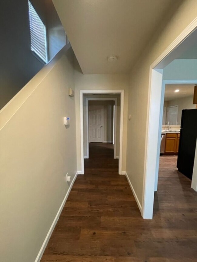 Building Photo - Must see this 4 bedroom 2.5 bath townhouse with 1 car garage .
