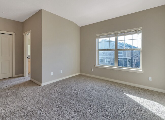 Building Photo - 2BR + 2.1BA Corner Townhome-Style Condo — Dual Primary Suites, Attached Garage & Most Utilities I...