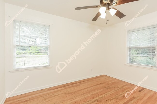 Building Photo - This Cozy 4 bedroom / 2 full bath and 2,09...