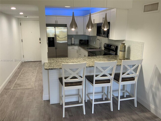 Building Photo - 6444 Collins Ave